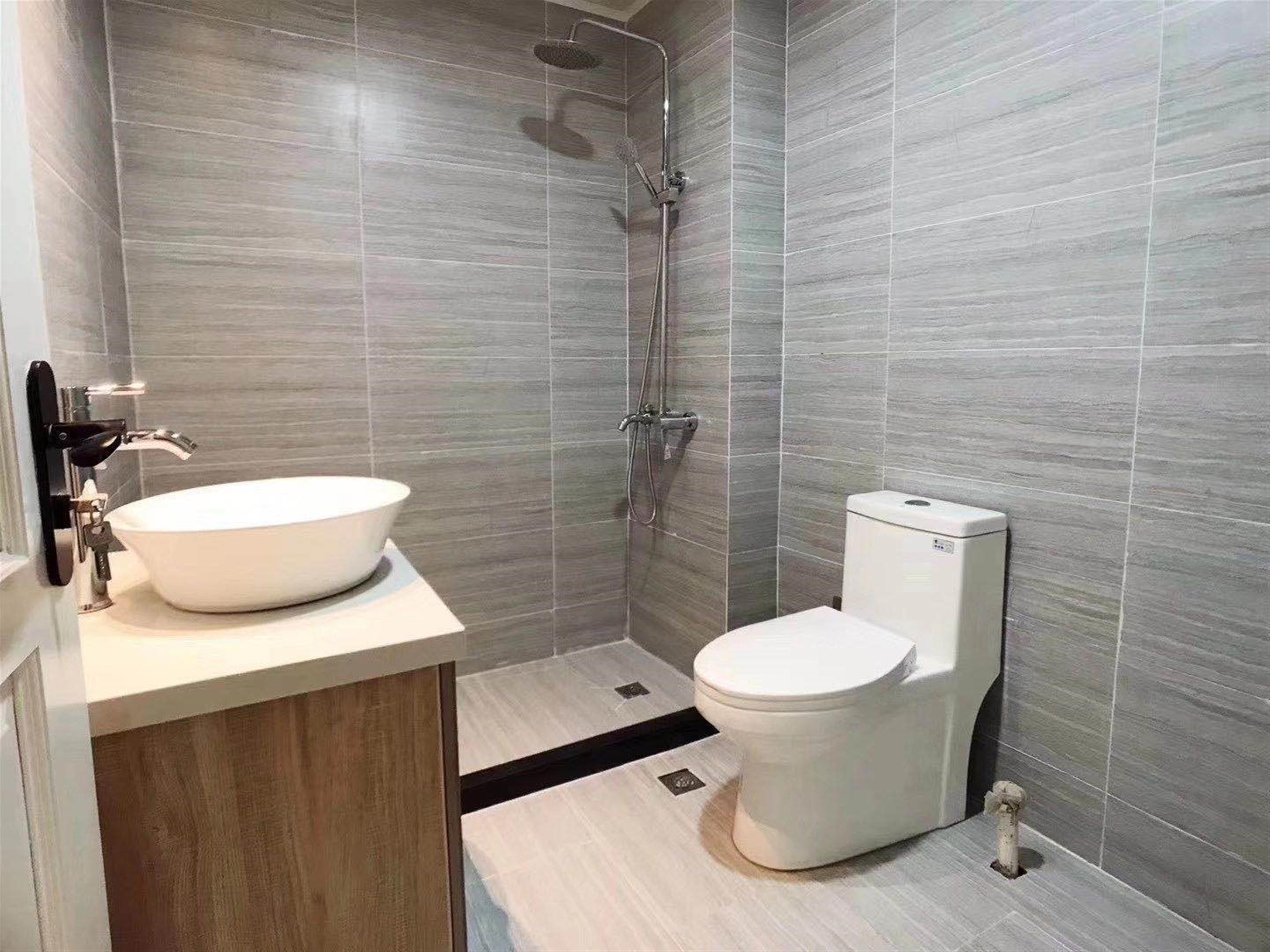 clean bathroom Convenient Newly-Renovated 2BR Huaihai Rd Apt Nr LN 1/8 for Rent in Shanghai