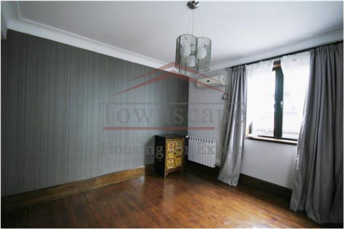 partially furnished french concession apartment for rent 2 level lane house with terrace and wall heating in center of Shanghai
