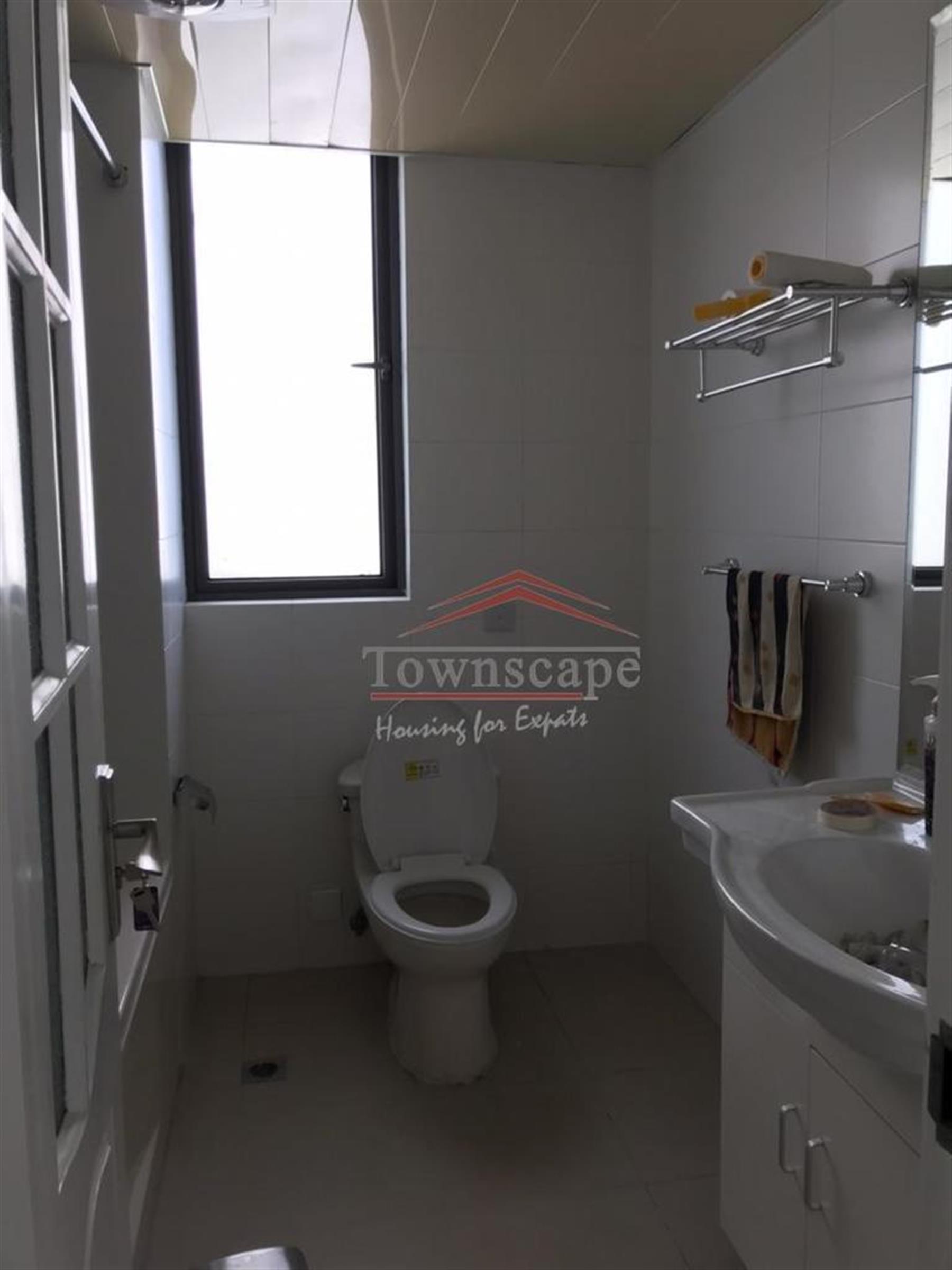windowed bathroom Spacious Renovated Nanjing W Rd Apartment for Rent in Shanghai