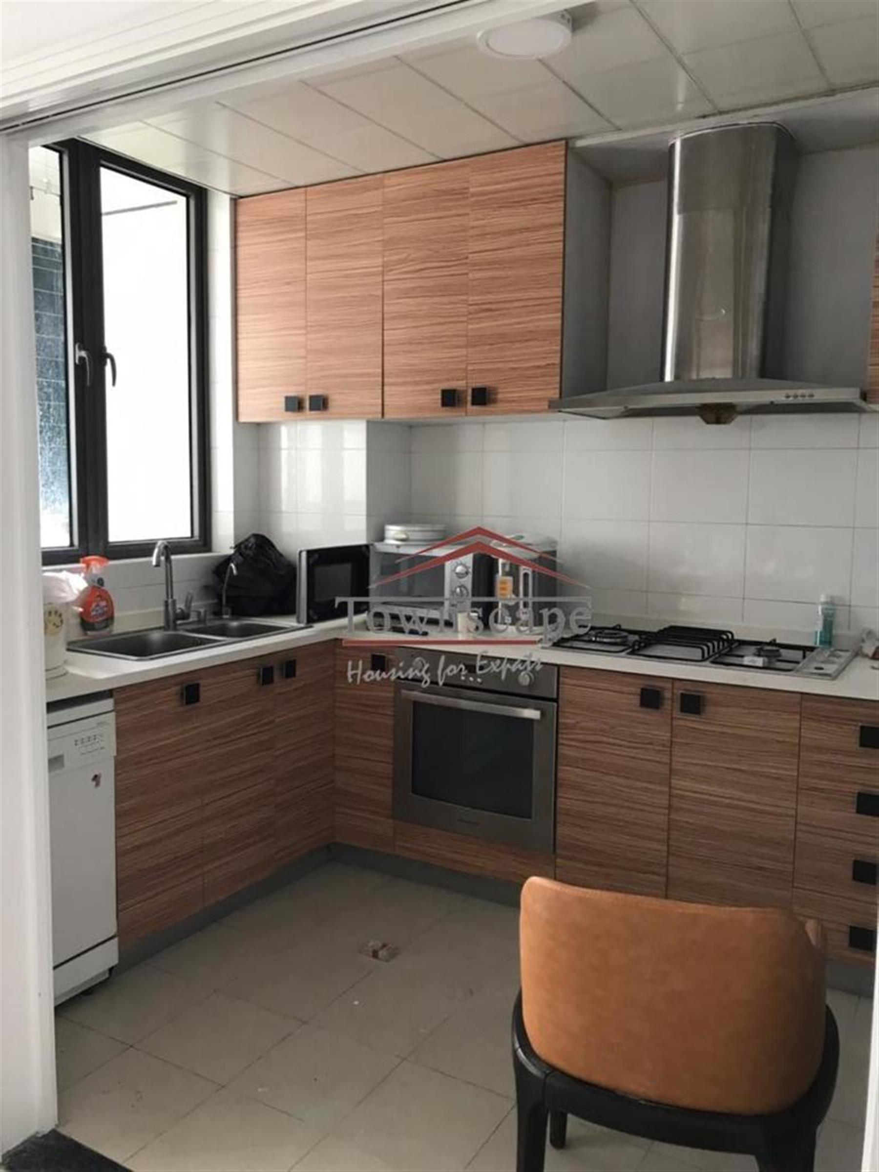 large kitchen Spacious Renovated Nanjing W Rd Apartment for Rent in Shanghai