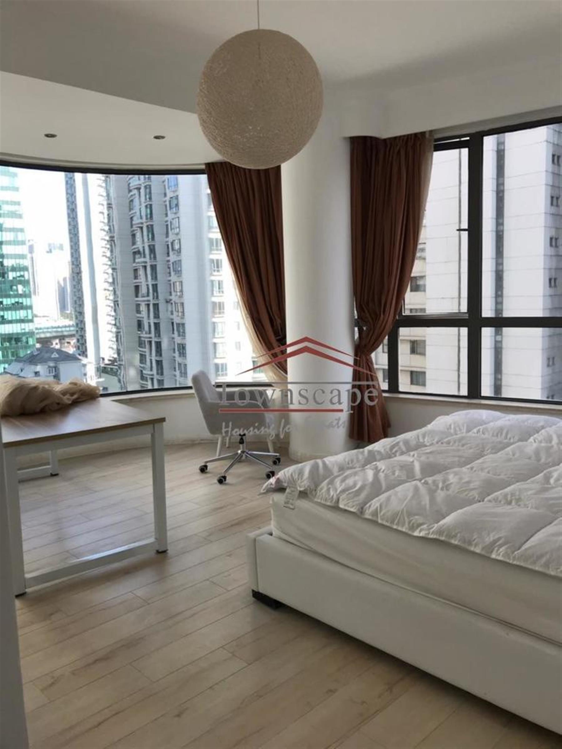 wrap-around windows Spacious Renovated Nanjing W Rd Apartment for Rent in Shanghai