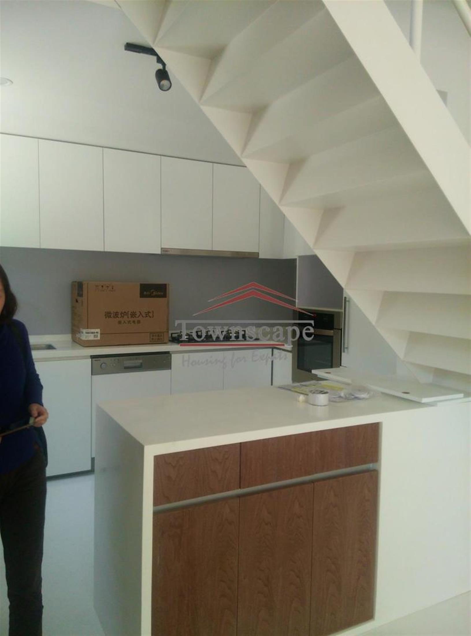 kitchen island Sleek Renovated FFC Lane House for Rent in Shanghai