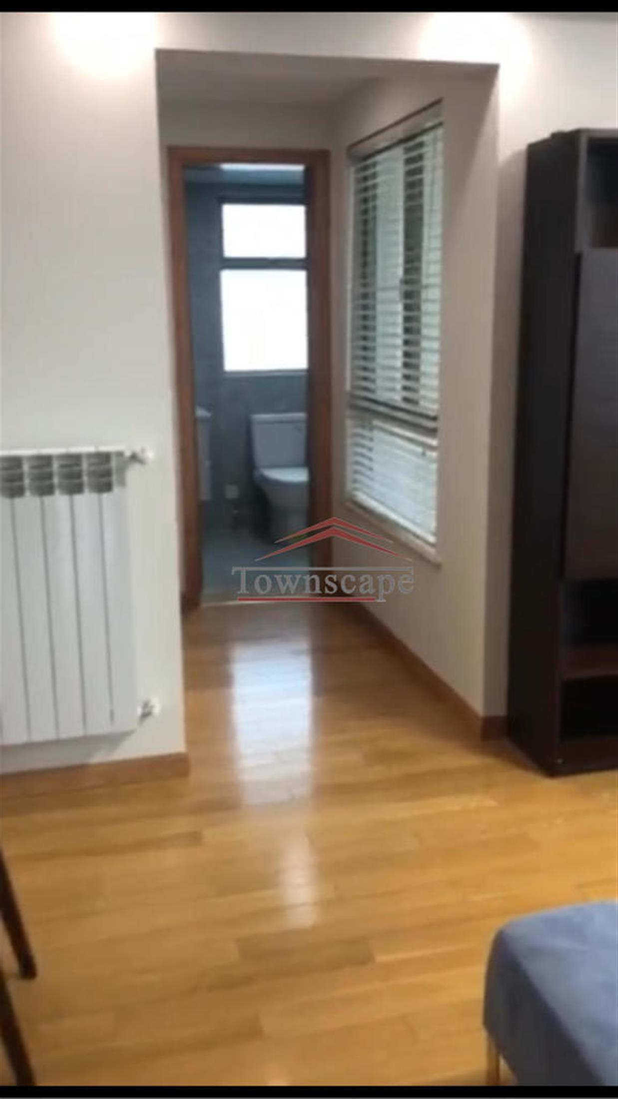 shiny wood floors Newly Renovated One Park Ave Apartment in Jing’an, Shanghai for Rent