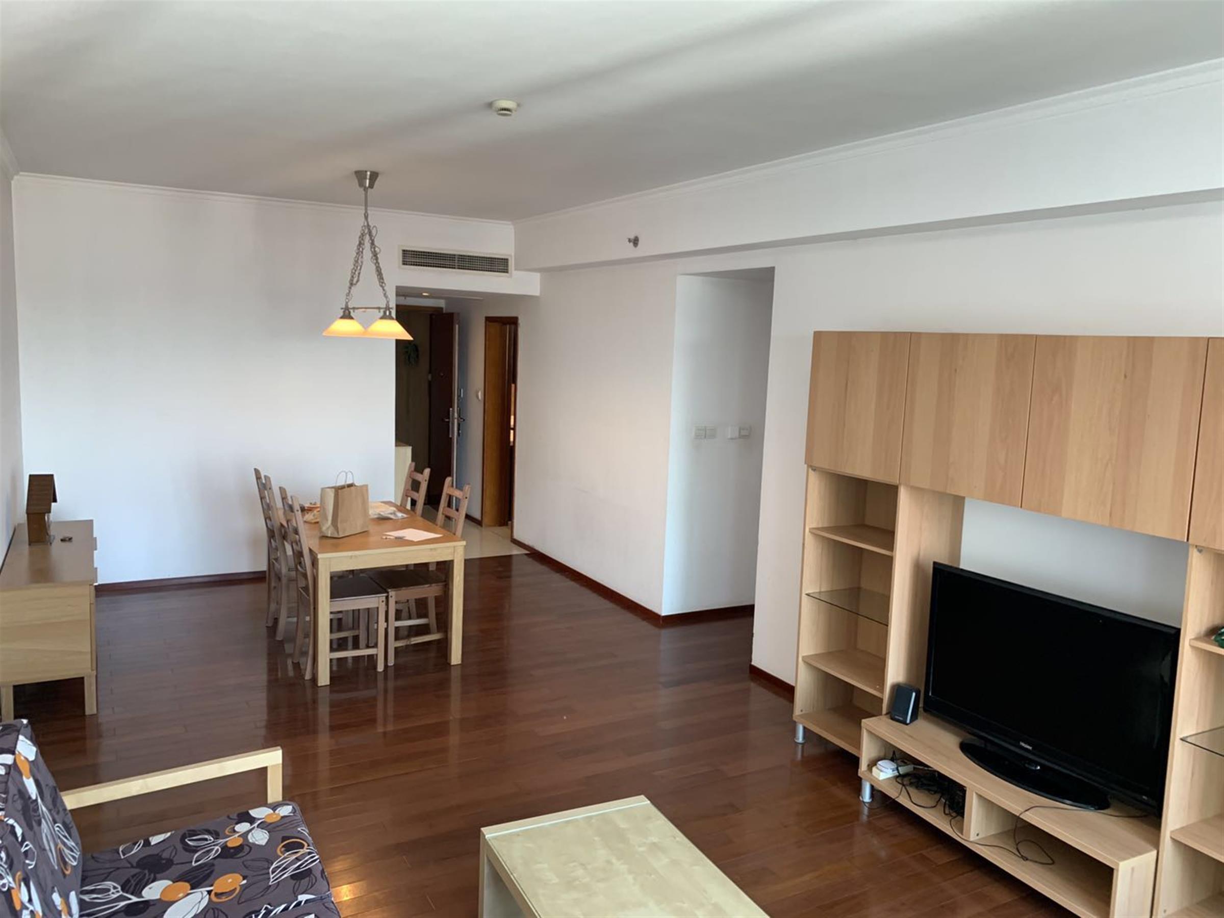 Open living room Bright Large Apartment w Great Views in Xujiahui Shanghai for Rent