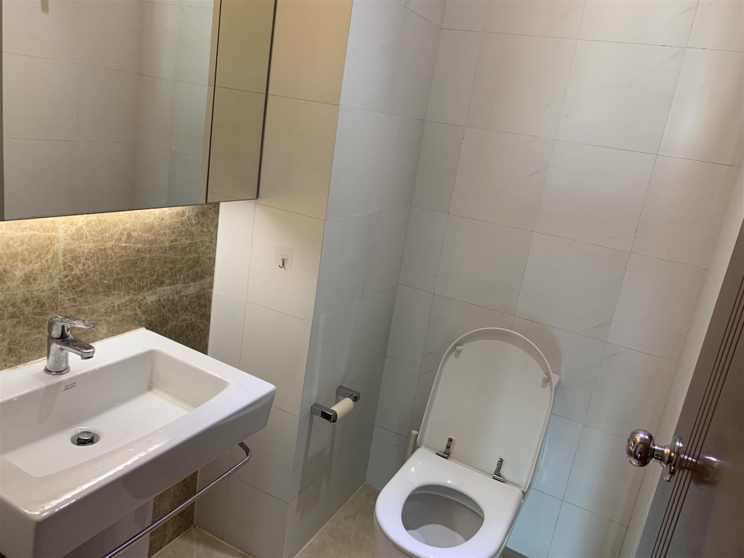 Clean bathroom Bright Large Apartment w Great Views in Xujiahui Shanghai for Rent