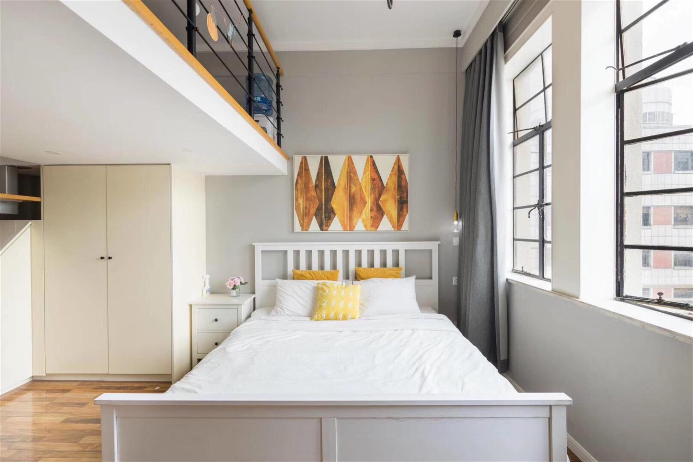 open bedroom Bright Modern 1BR Bund Apartment w Loft for Rent in Shanghai