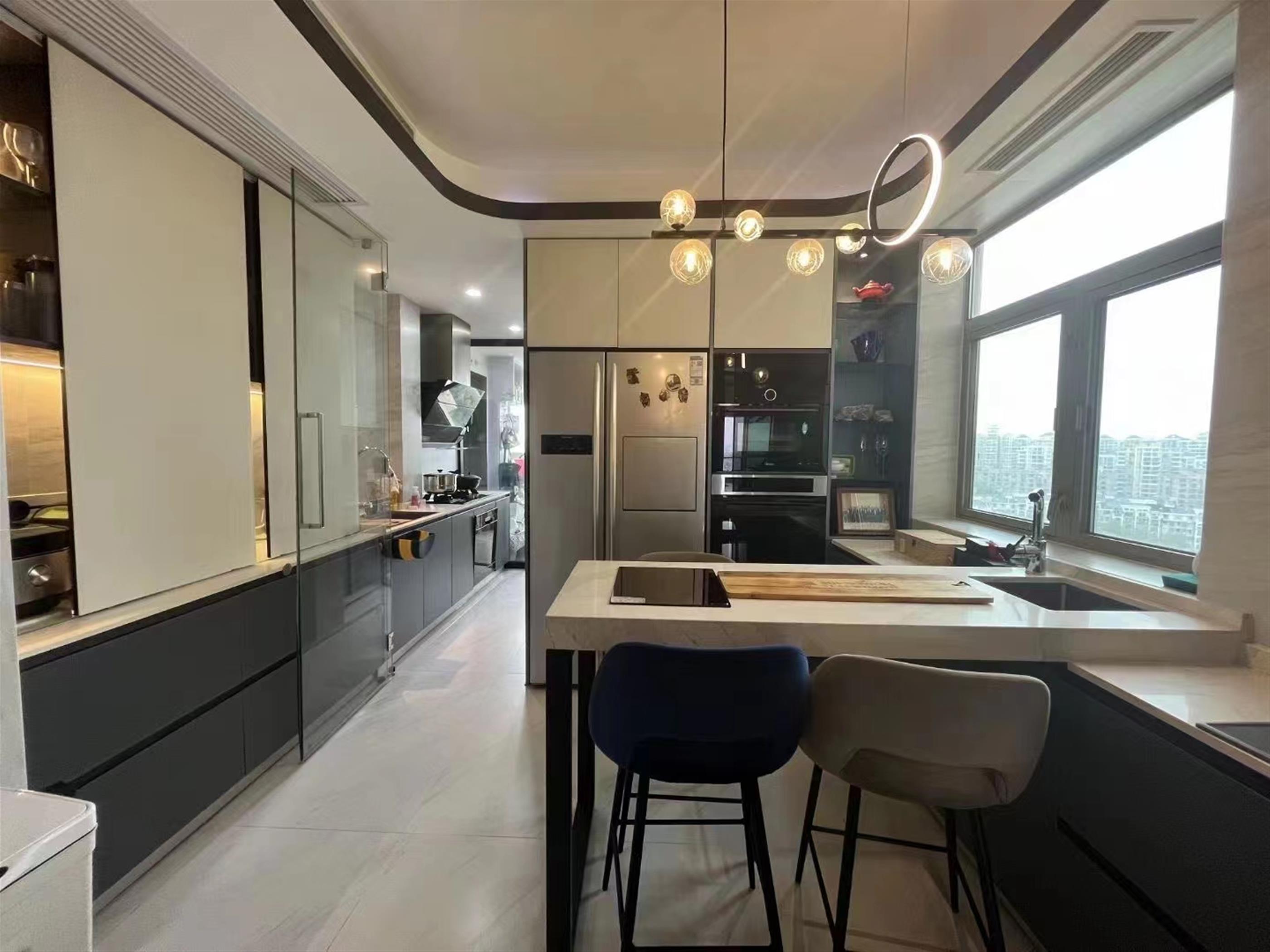 Open kitchen and kitchen island Classic Spacious Chic 3BR Apartment for Rent in Shanghai’s Jing’an Temple Neighborhood